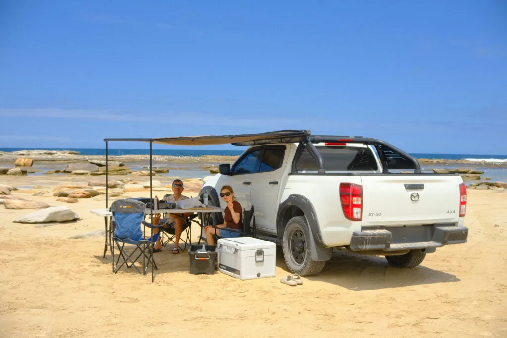 4WD parked on sandy beach at Boat Harbour Park in Kurnell, Sydney