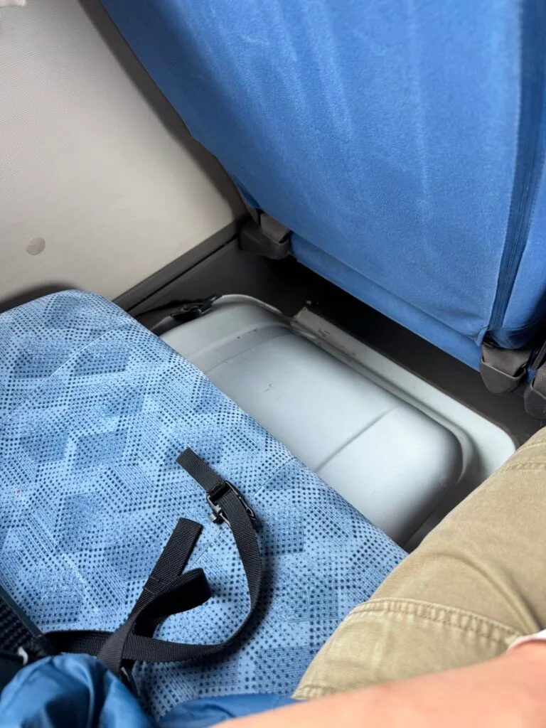 Bulging wheel-well under the seat next to me