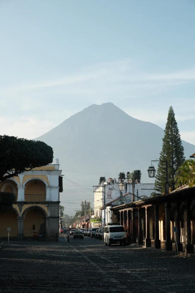 Large volcano in the background of Antigua's cobblestone streets