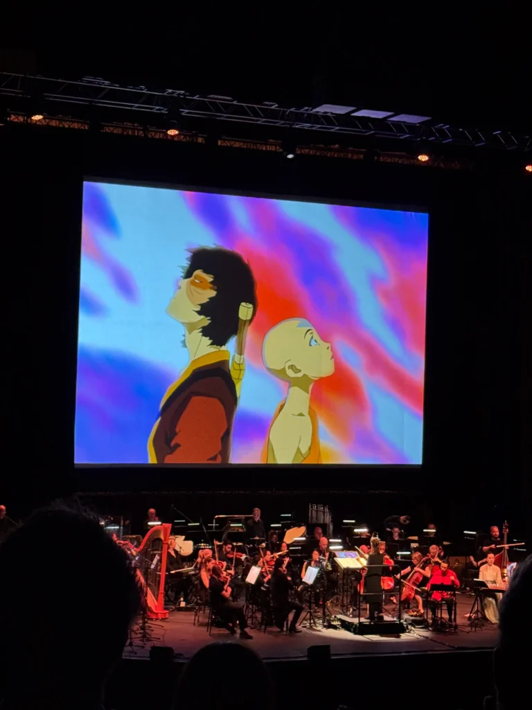 Aang and Zuko on screen with orchestra playing live