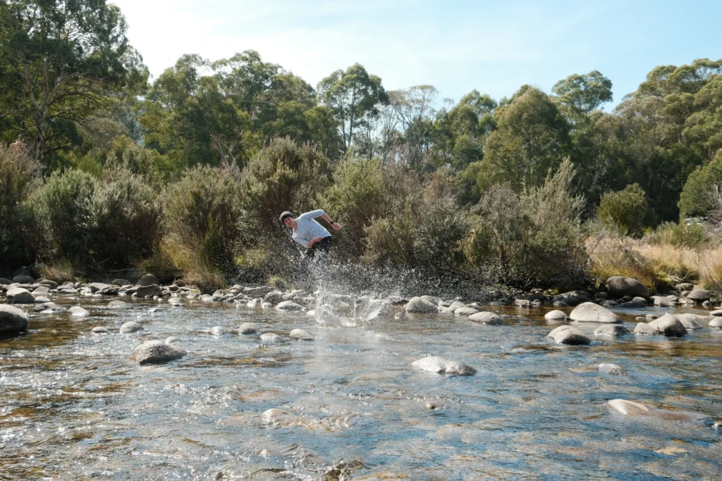 Man skipping a rock on a lake