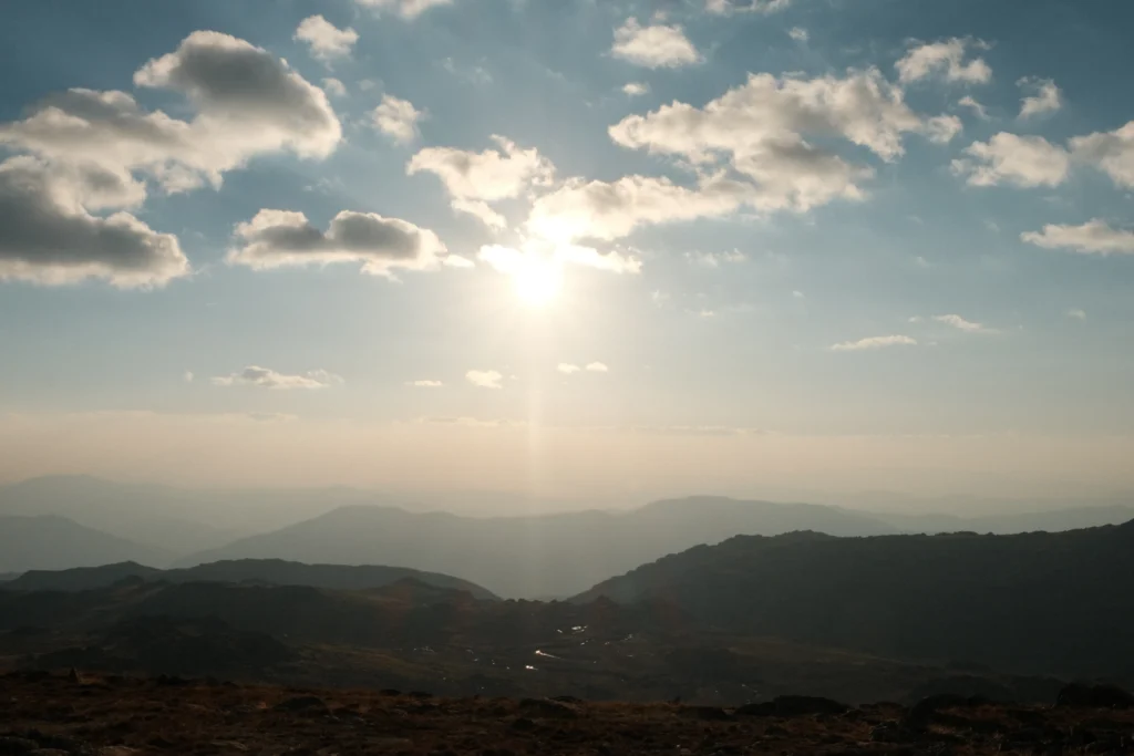 The view from the top of Australia, sweeping mountain ranges and a setting sun
