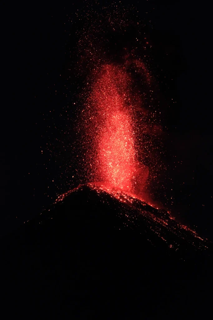 Acatenango_volcano_SeanSojourns Exploding red lava from volcano