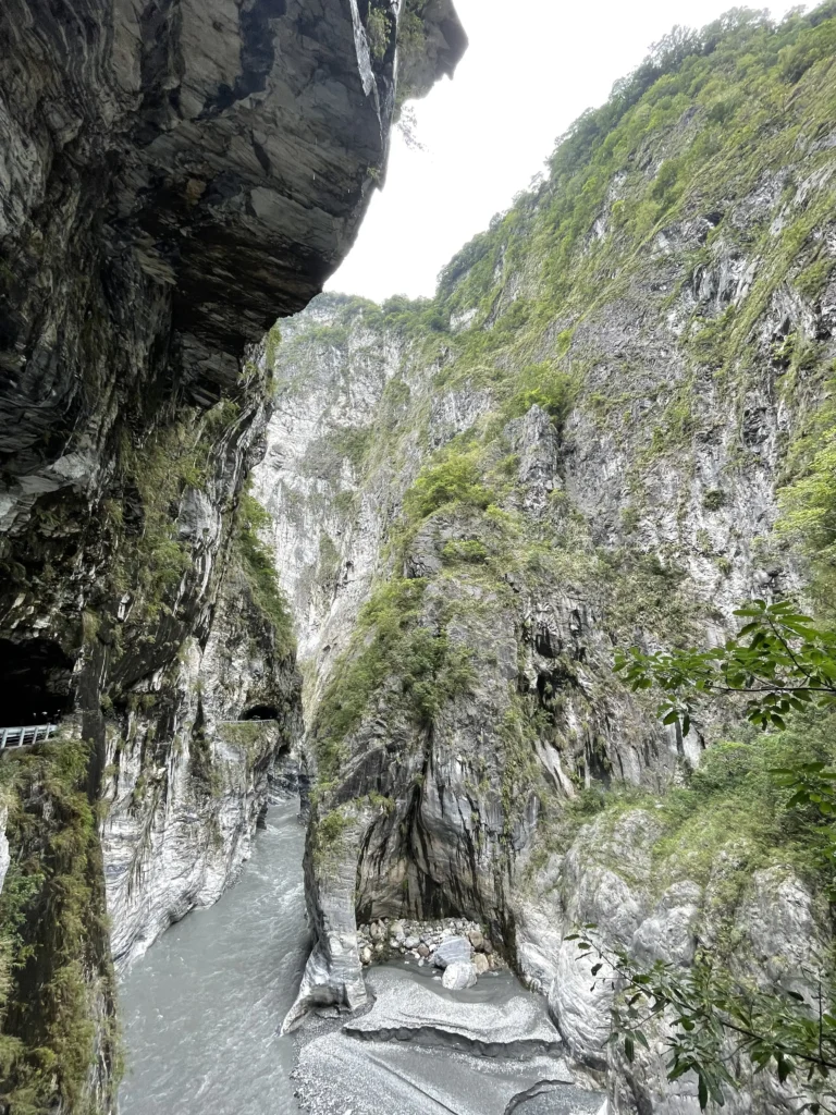 The stream cutting through marble cliffs