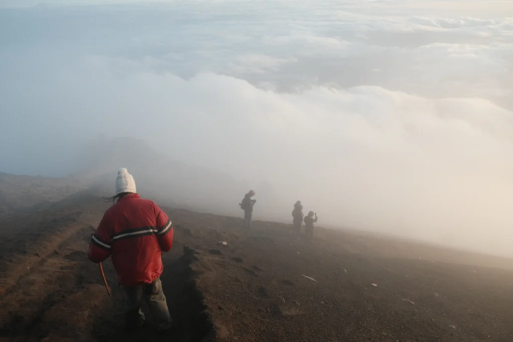 Hikers walking down the summit.