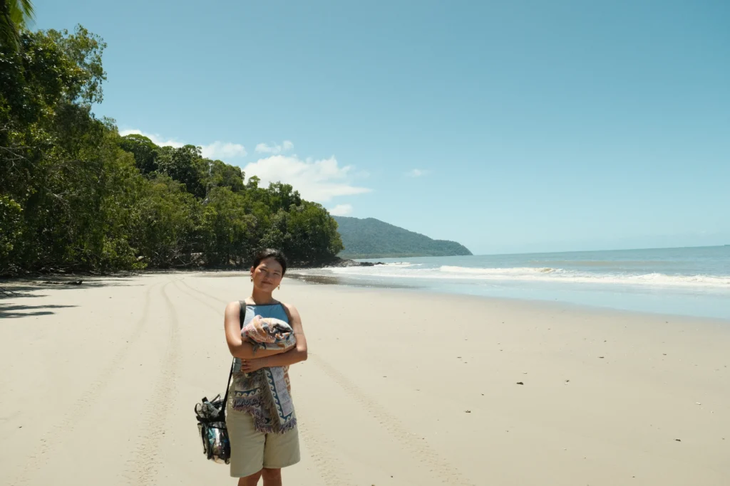 Girl on empty beach in the Daintree