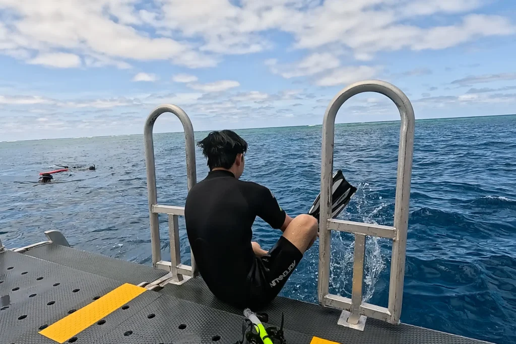 Me sitting on the side of the boat getting ready to snorkel