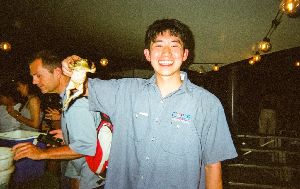 me holding a cane toad at the cane toad racing night