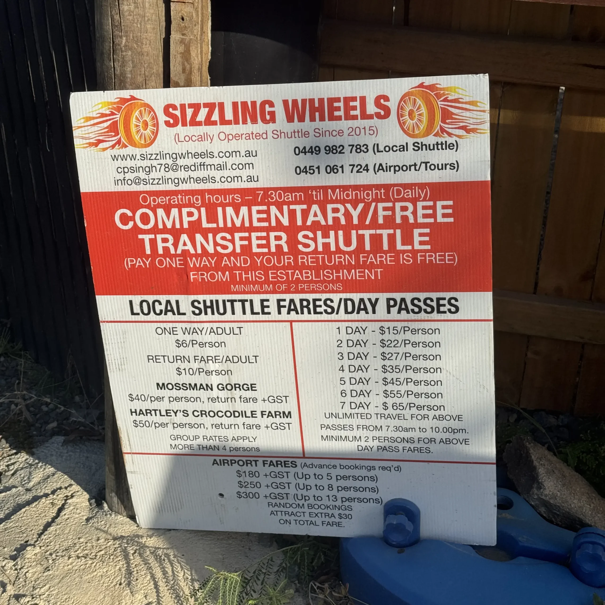 Sizzling Wheels sign reads "Complimentary/free transfer shuttle"